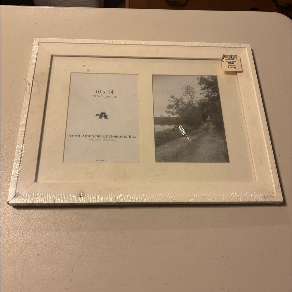 White Photo Frame 10 x 14. 2) 5 x 7 openings. Plastic over
